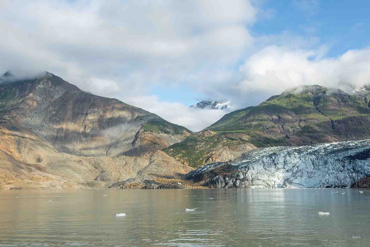 From the sea, facing a landslide and glacier.