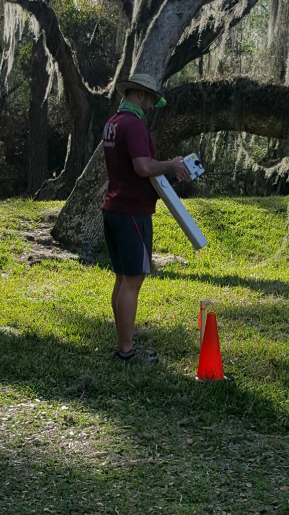 SEAC archeologist Eric Bezemek preparing to survey a grid with the magnetometer unit. SEAC archeologist Eric Bezemek preparing to survey a grid with the magnetometer unit.