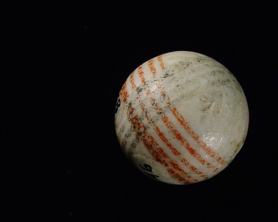 White marble with black and red stripes.