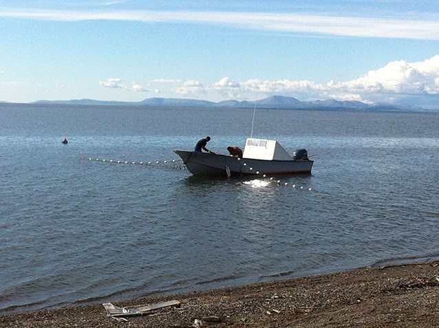 people in a boat fishing off the coast