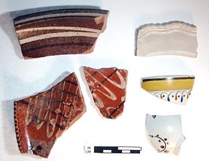 Ceramics such as slip-decorated redware, white salt-glazed stoneware, and handpainted pearlware provide clues about trade, lifestyle, and consumption habits. Ceramics such as slip-decorated redware, white salt-glazed stoneware, and handpainted pearlware provide clues about trade, lifestyle, and consumption habits.