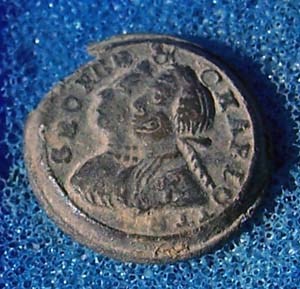 Metal button displayed against blue background. Metal button displayed against blue background.