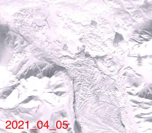 satellite image of ice and dark rocks moving down a glacier