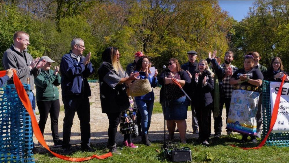 Community members and project partners gathered to celebrate the ribbon cutting for the Serpent Mound in Schiller Park, photo courtesy of Thomas Callahan.