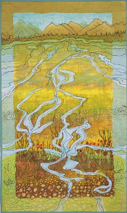 a quilt depicting a landscape scene with rivers flowing down from mountains