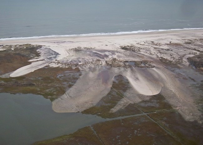 lt= aerial view of dune overwash fan