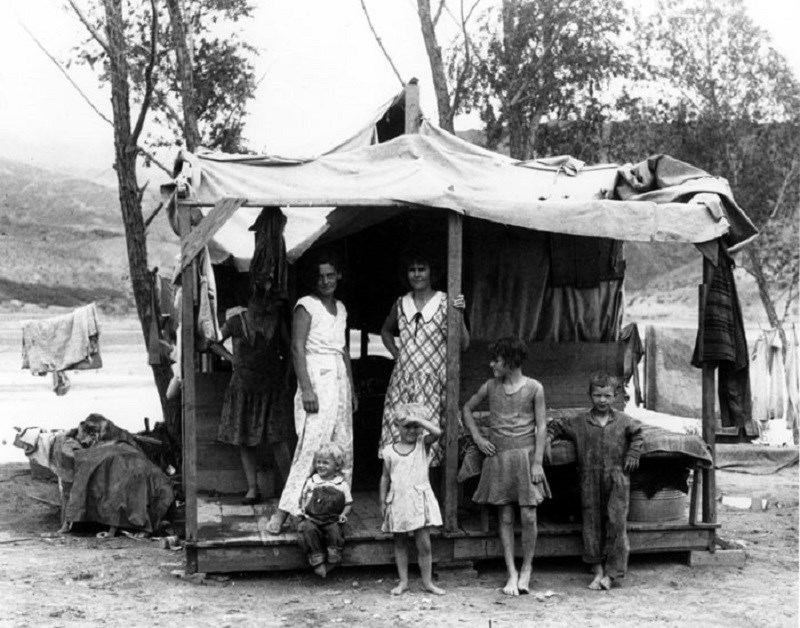 Women and children under temporary shelter (called "ragtown") while men look for work to build Hoover Dam. (Boulder City Museum and Historical Association; photographer unknown. Used by permission) Women and children under temporary shelter (called "ragtown") while men look for work to build Hoover Dam. (Boulder City Museum and Historical Association; photographer unknown. Used by permission)
