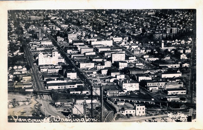 Black and white image showing an aerial view of downtown Vancouver.