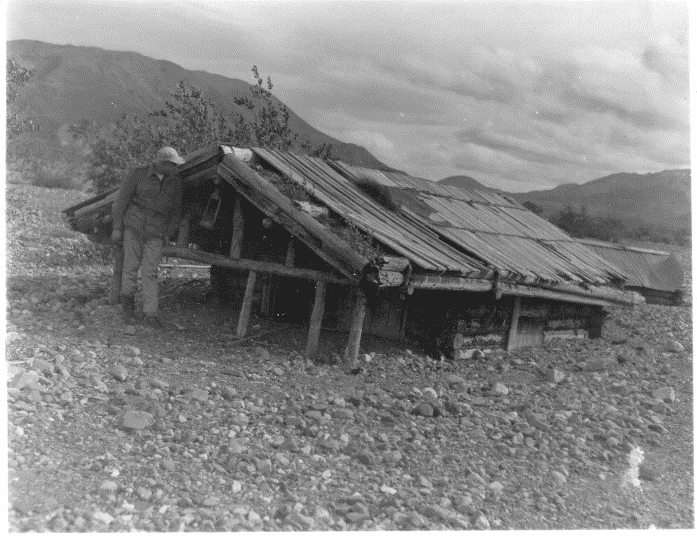 power 2 a log cabin sunken far into a river bank