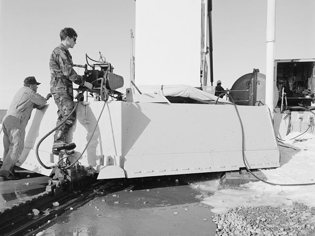 Pulling the missile from Delta-09, 1992 Airman works a control on the rear of a blast door