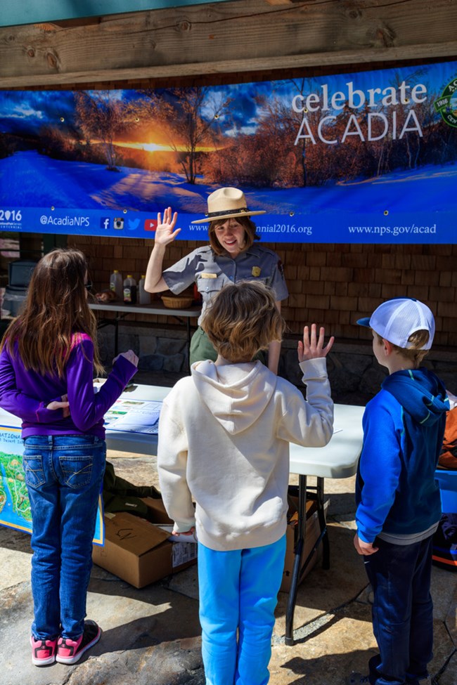 National Park Service Ranger with children at Acadia National Park. NPS photo.