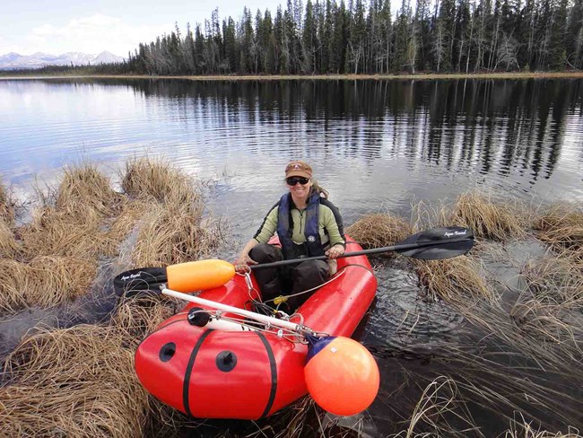 Amy Larsen doing shallow lake field work.