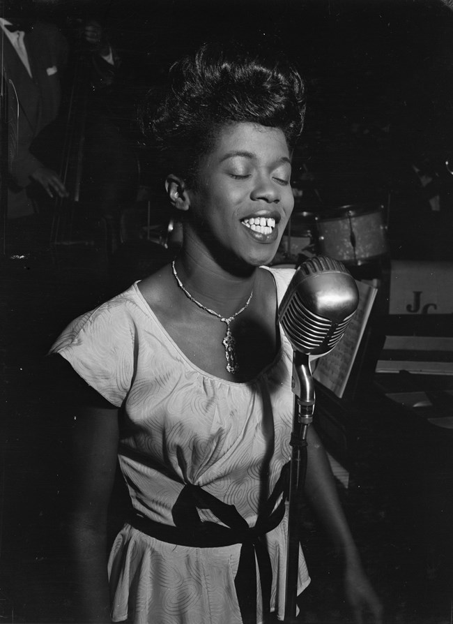 Photo of a woman singing. Library of Congress.