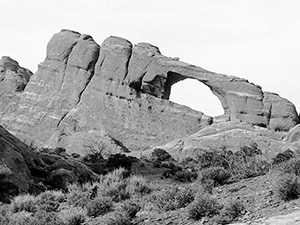 an arch in a high wall