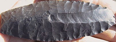Sluiceway Point A sharp sluiceway point, found in Noatak National Park and Preserve, is intricately carved.