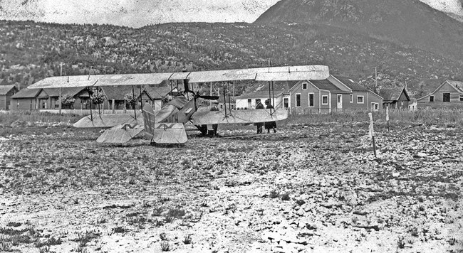 plane on the ground view from behind black and white