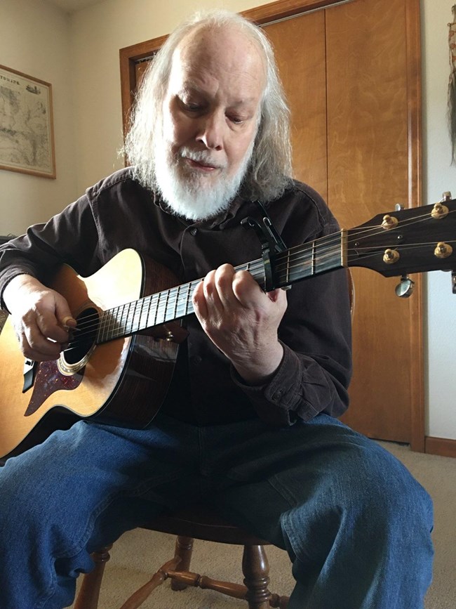 Steve Whissen playing guitar