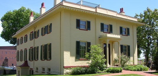 Taft Home Front, outdoor view of Taft's yellow home.