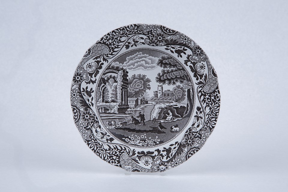 transferware process 2 A small plate with a rural scene on it in dark brown.