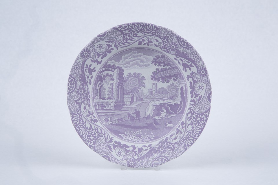 transferware process 3 A small plate with a rural scene on it. The color of the print is now light purple.