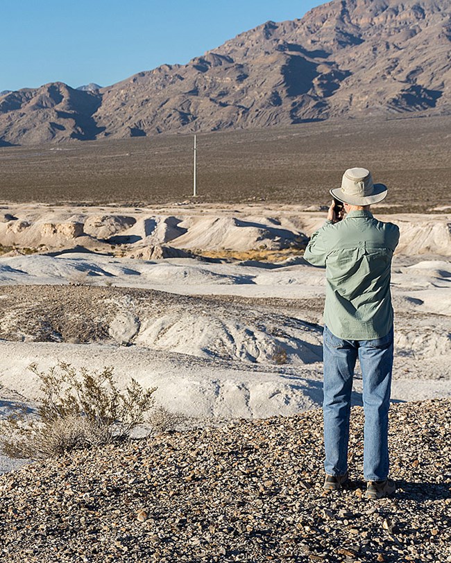 photographer in desert landscape