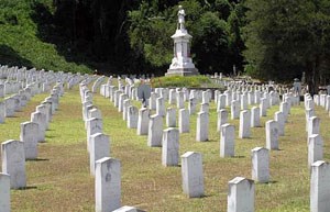 Rows of uniform marble headstones.