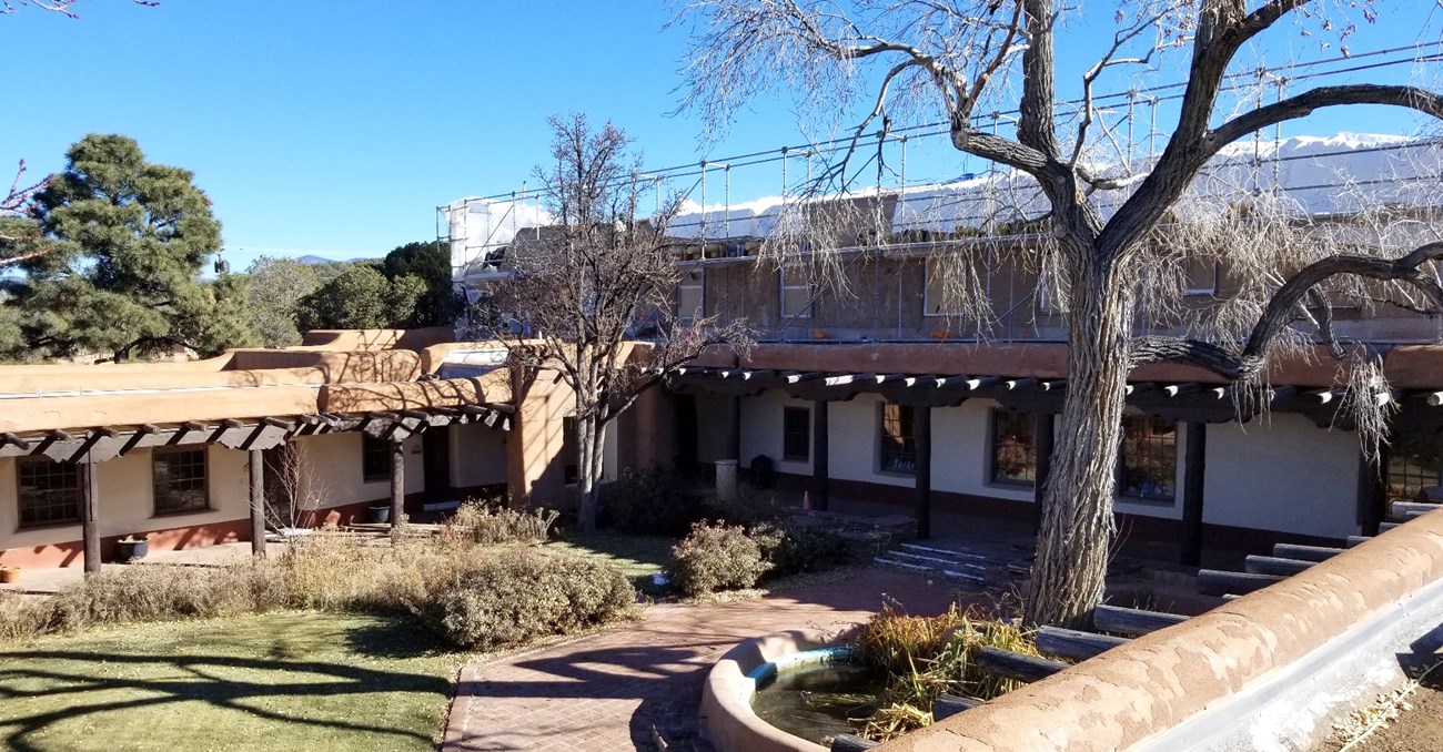 From roof, looking down at courtyard and across to second story construction