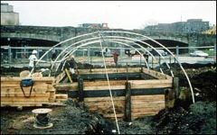 Wooden shoring and the construction of the temporary structure.