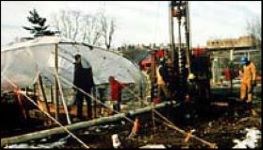 Temporary structure with plastic covering. Temporary structure with plastic covering.