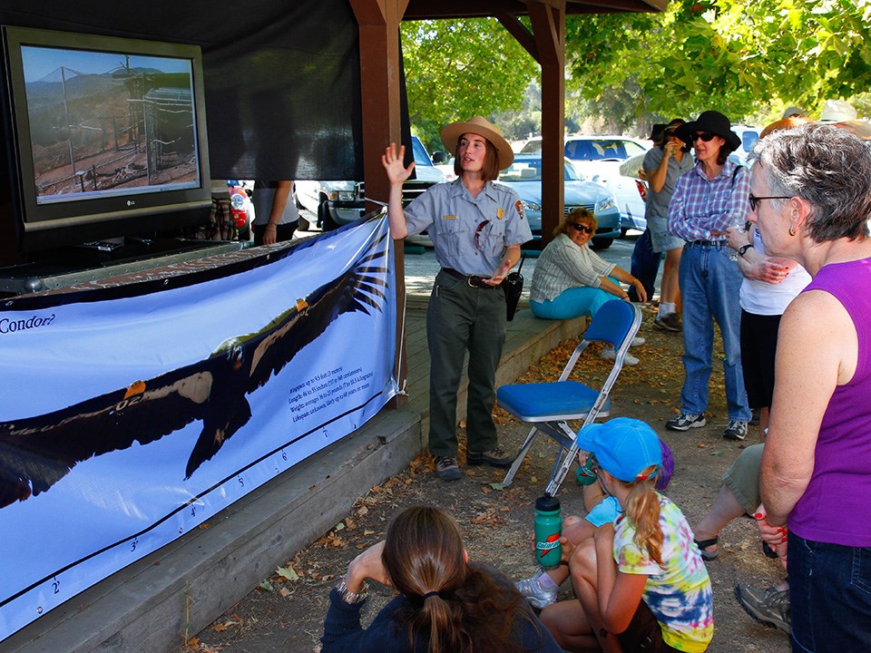 Condor Crew Leader Alacia Welch talks to visitors at a Condor Celebration event.