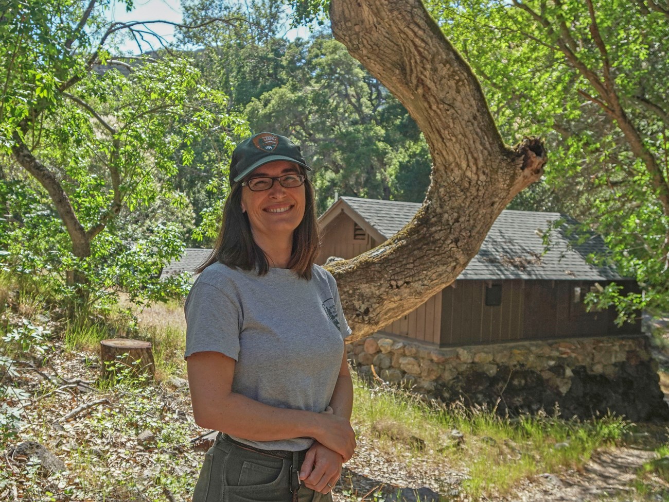 Condor Crew Leader Alacia Welch. Condor Crew Leader Alacia Welch smiles under some trees.