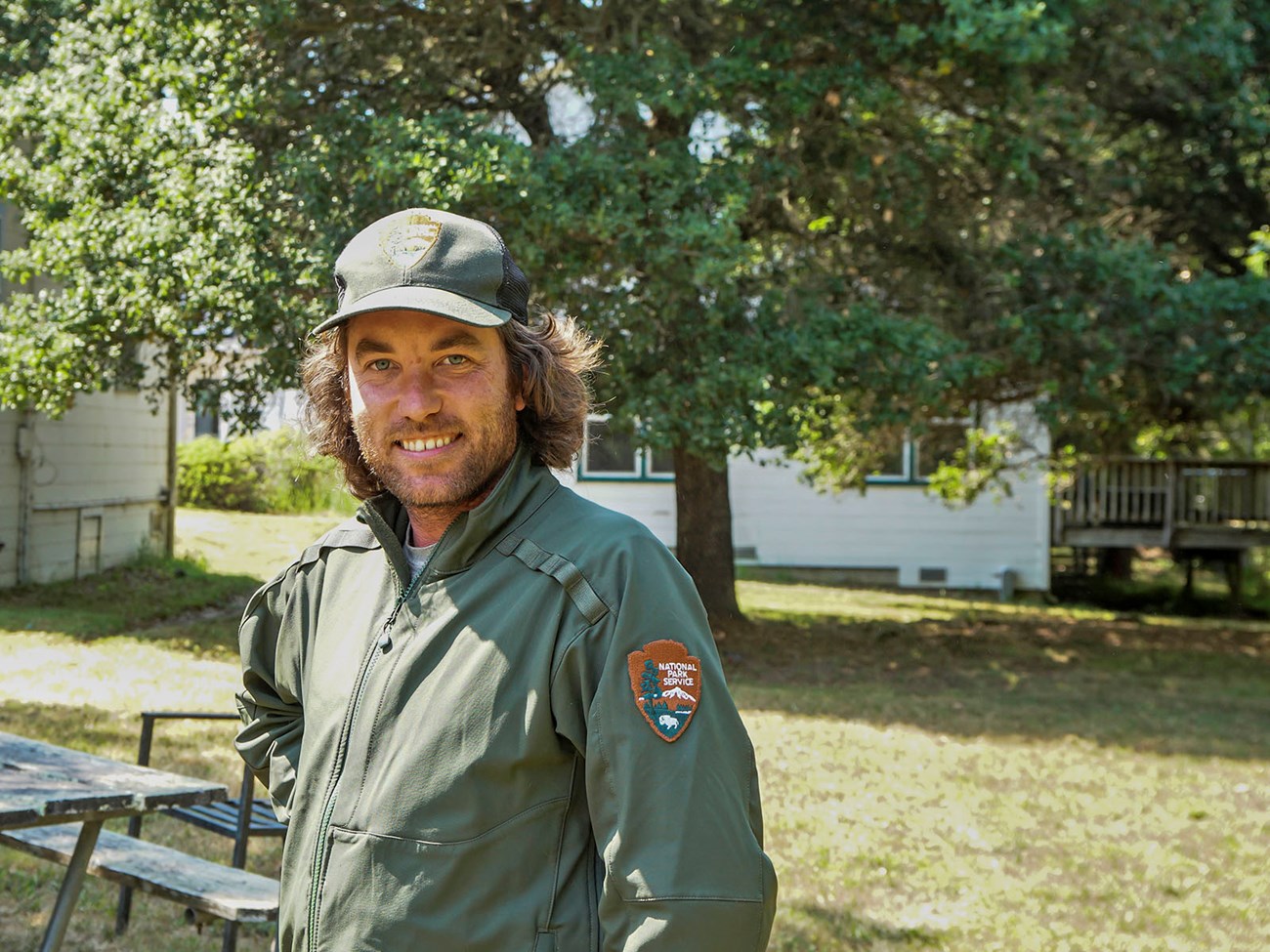 Wildlife technician Taylor Ellis smiles outside the Point Reyes headquarters.