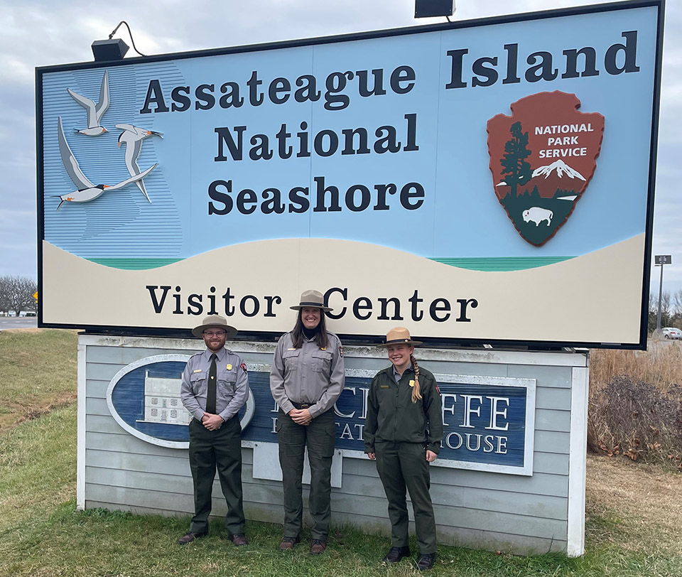 Park Superintendent's and Safety Award winners, Markus Williams, Tami Pearl and Anastasia Rhodes stand in front of the Assateague Island National Seashore entrance sign. Park Superintendent's and Safety Award winners, Markus Williams, Tami Pearl and Anastasia Rhodes stand in front of the Assateague Island National Seashore entrance sign.