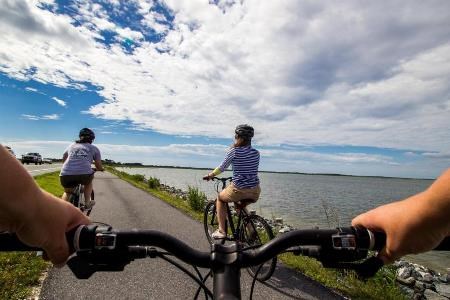 photo of visitors biking in the Maryland district taken from the perspective of one of the bikers.