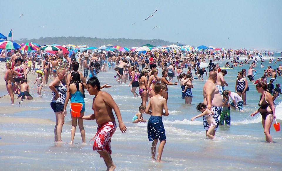 visitors in the ocean surf