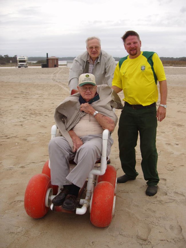 Family using beach wheelchair