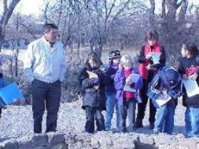 Taos Pueblo member Benny Romero talks to young writers at Aztec Ruins