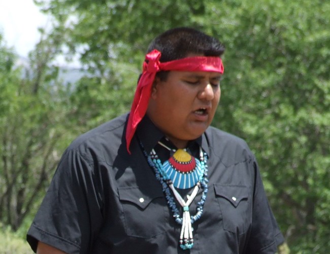 A man from the Red Turtle dance group singing as part of their demonstration.
