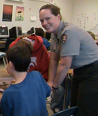 Ranger Shoup presents an educational program in a local school's classroom.