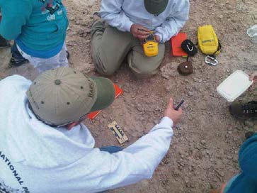 Paleontologists uncover a fossil tooth.