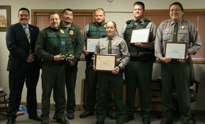 Group of award recipients display their awards