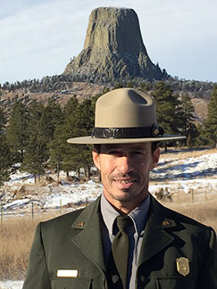 Deputy Superintendent Reed Robinson stands in front of Devil's Tower NM.
