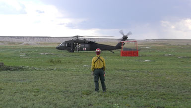Park staff standing in front of helicopter
