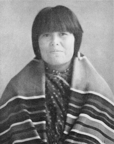 A black and white portrait of a woman.