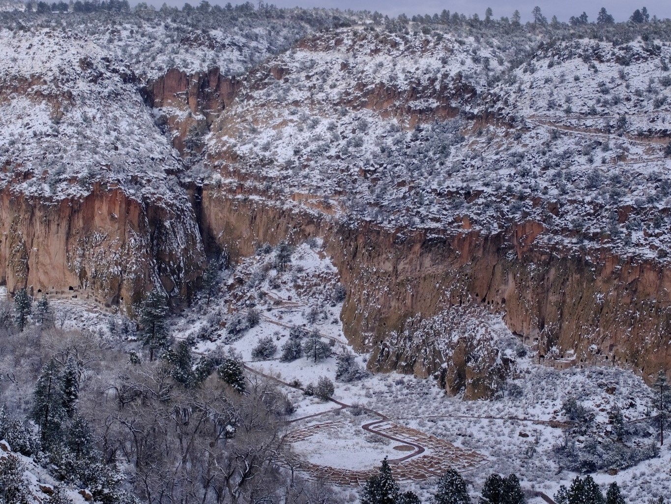 Tyuonyi Pueblo in Snow view of the snow covered frijoles canyon and Tyuonyi Pueblo