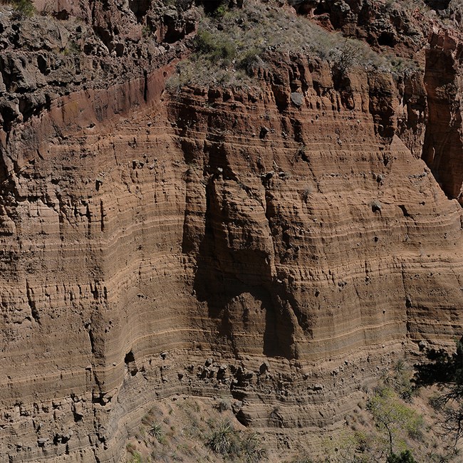 defined layers of red rock deposits