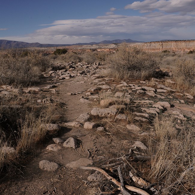 fallen stone walls lie into the distance