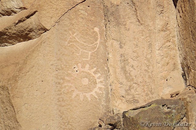 Two petroglyphs, one of a sun that might be a winter solstice marker.