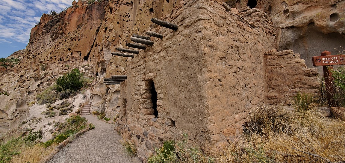 an image of a stone structure built along a cliff