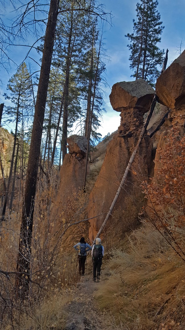 tent rocks tower over hikers